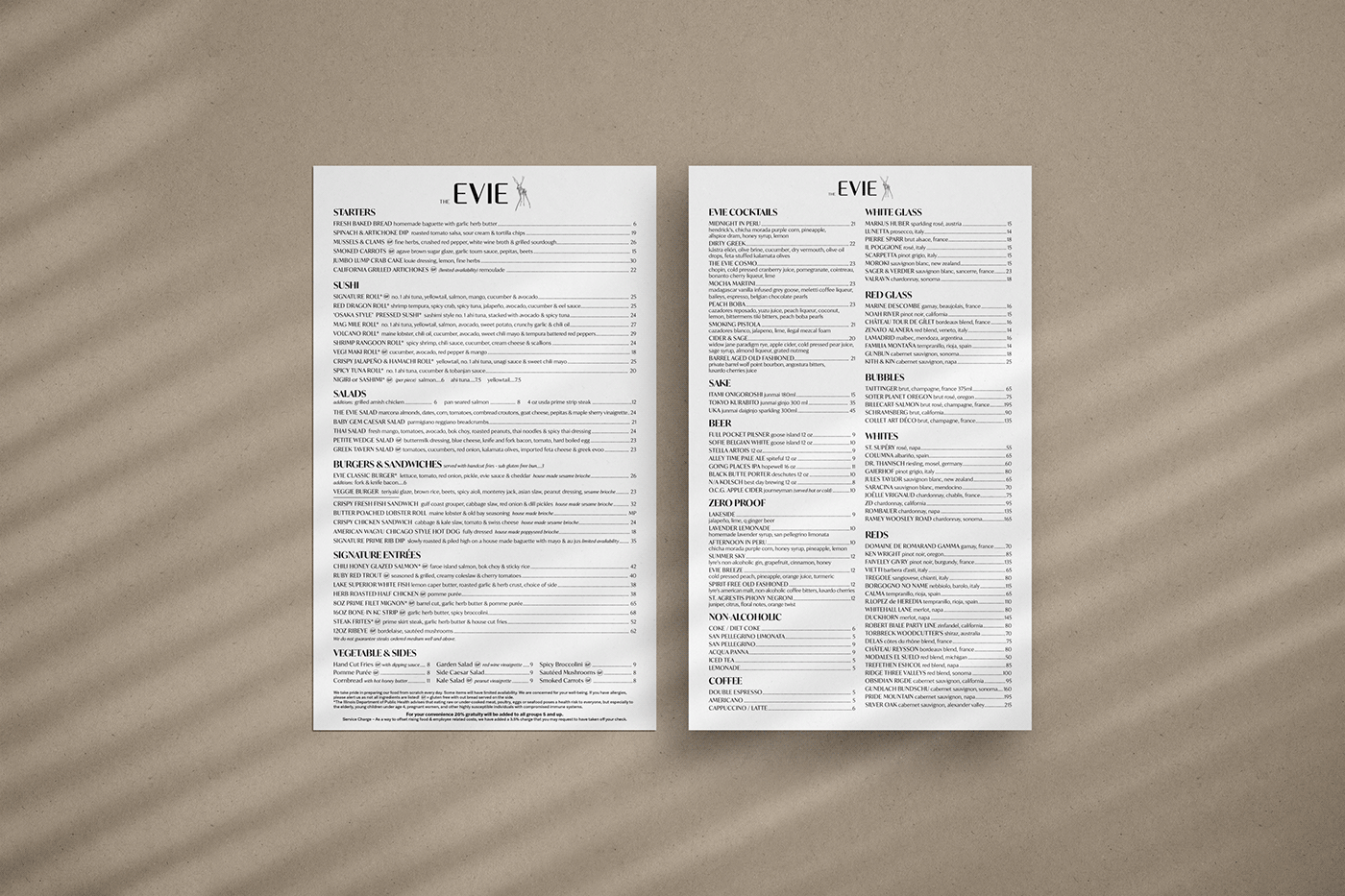 The Evie Chicago food and beverage menus arranged on a warm textured surface.